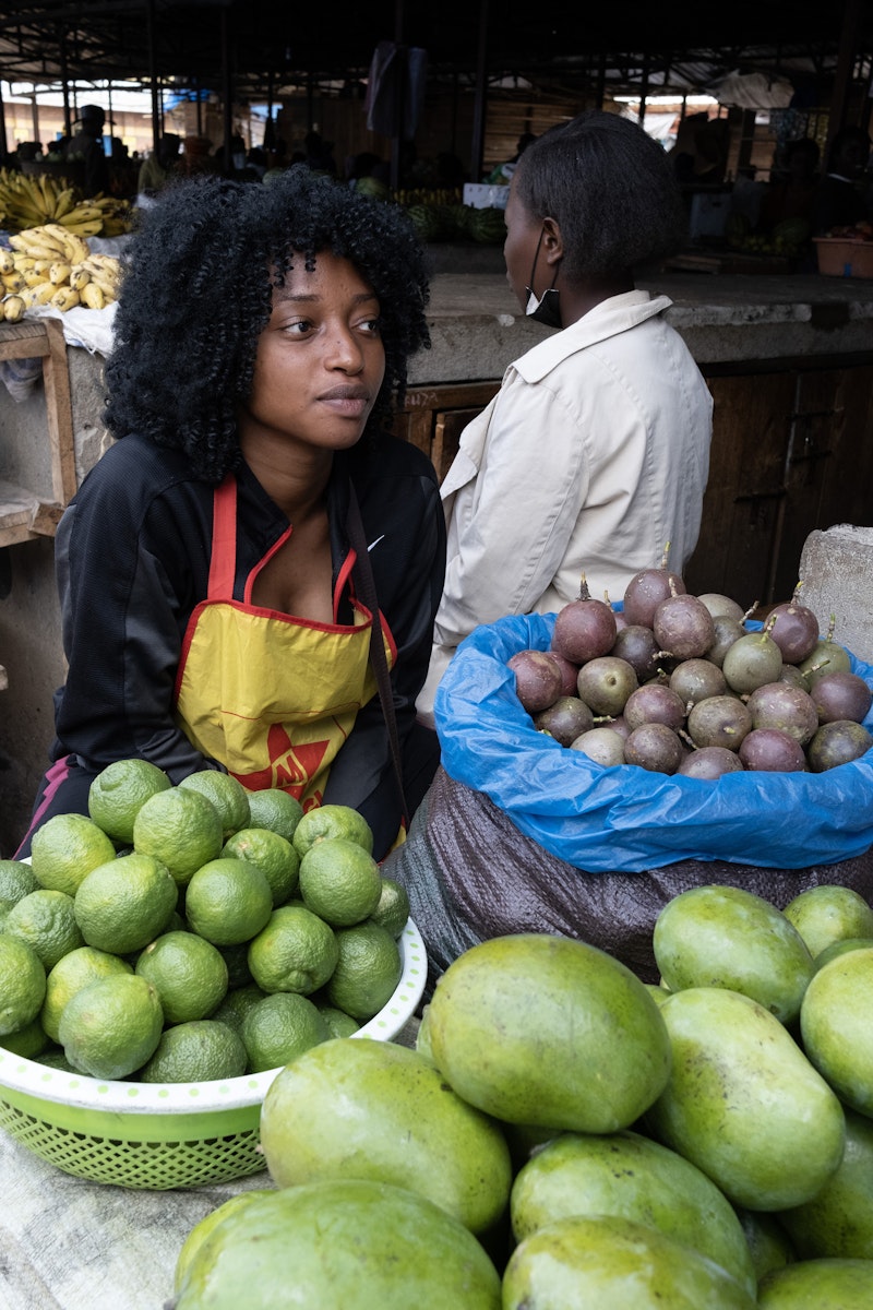 A woman selling goods at a market