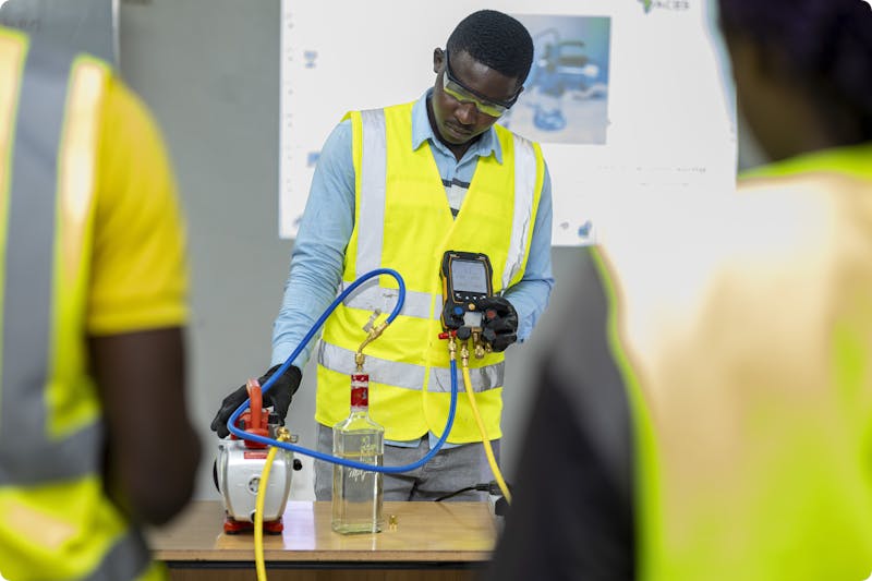 A training course instructor demonstrating equipment usage